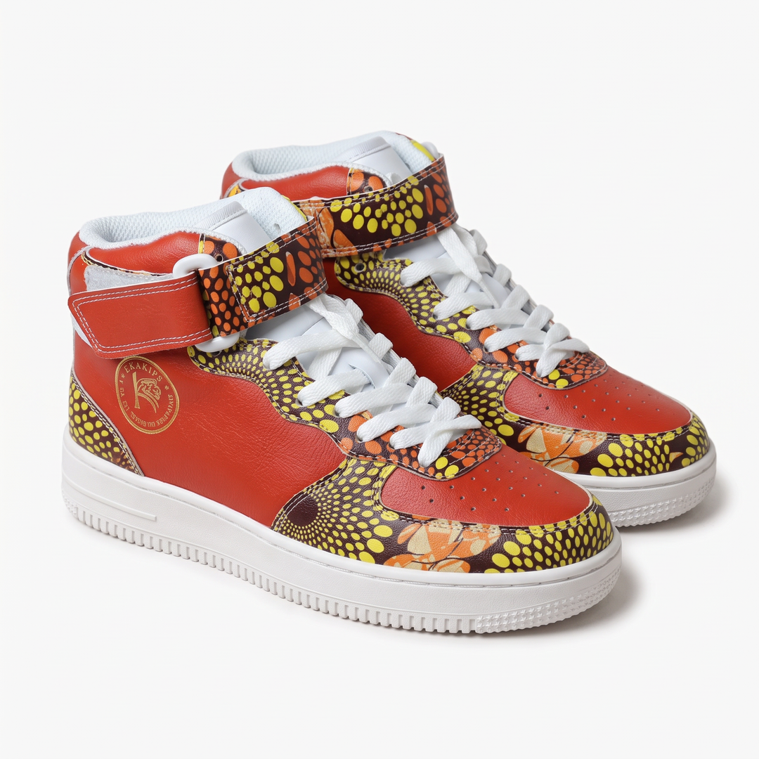 Baskets montantes KAKIPS Prestige Savane en cuir rouge et tissu wax à motifs géométriques jaunes et orange