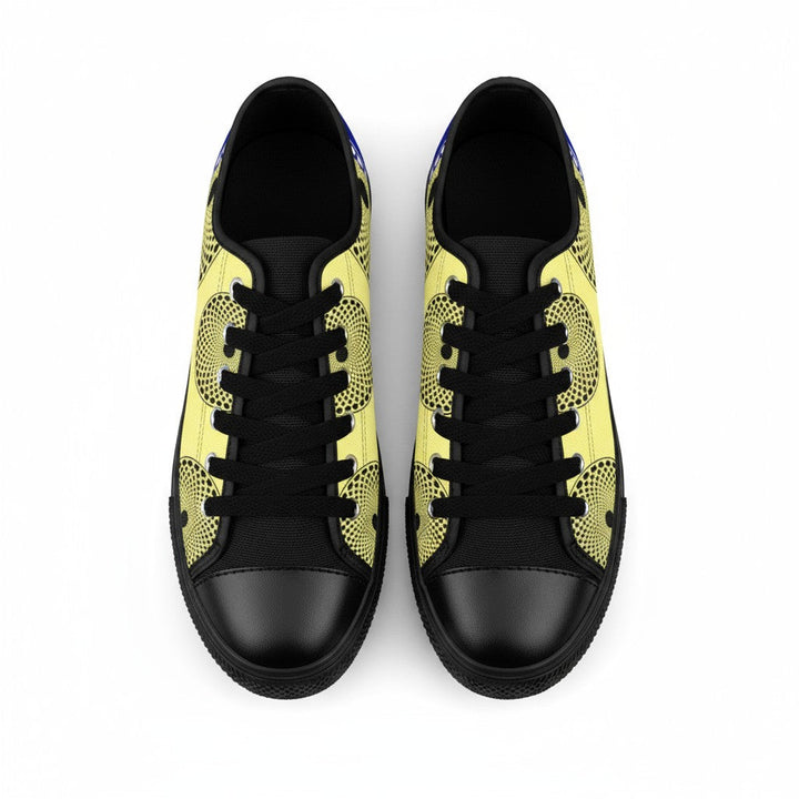 Sneakers KAKIPS Évasion BlueSun en toile jaune à motifs wax noirs, lacets noirs et bout arrondi, vue de dessus.