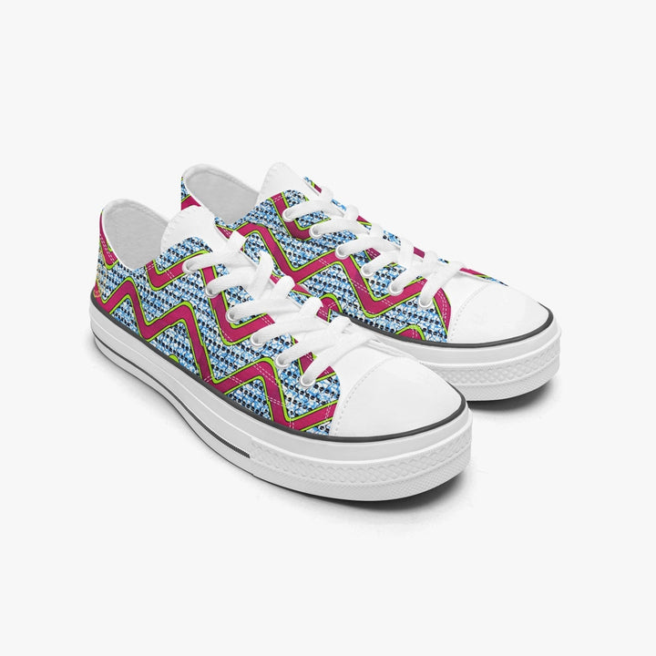 Sneakers KAKIPS Évasion Zebra Blanc en toile avec motif wax géométrique rose, bleu et blanc sur semelle blanche
